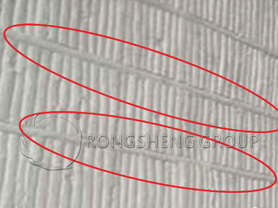 The ceramic fiber compensating blanket is compressed to a high density.
